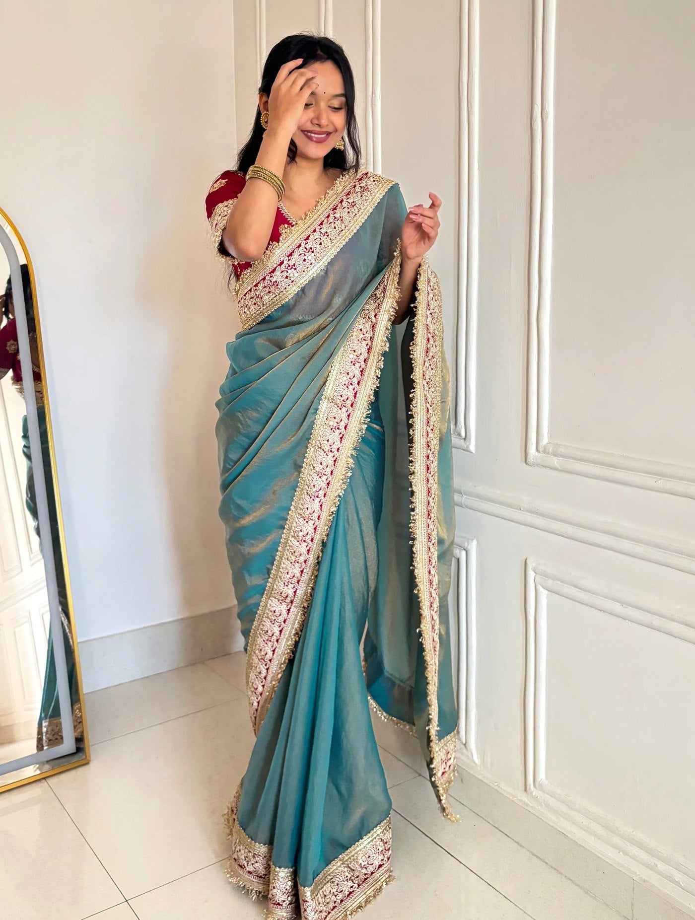 Elegant Teal Designer Saree with Heavy Embroidered Border & Red Blouse
